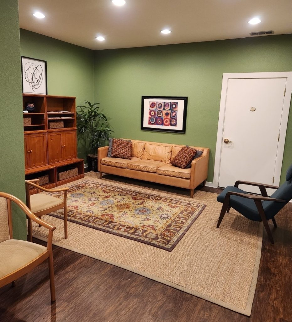 Lobby waiting area with couch chairs & restroom
