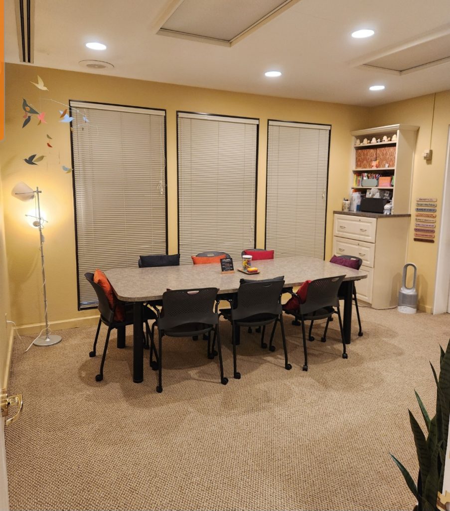 Mary's office with large table windows and decorations